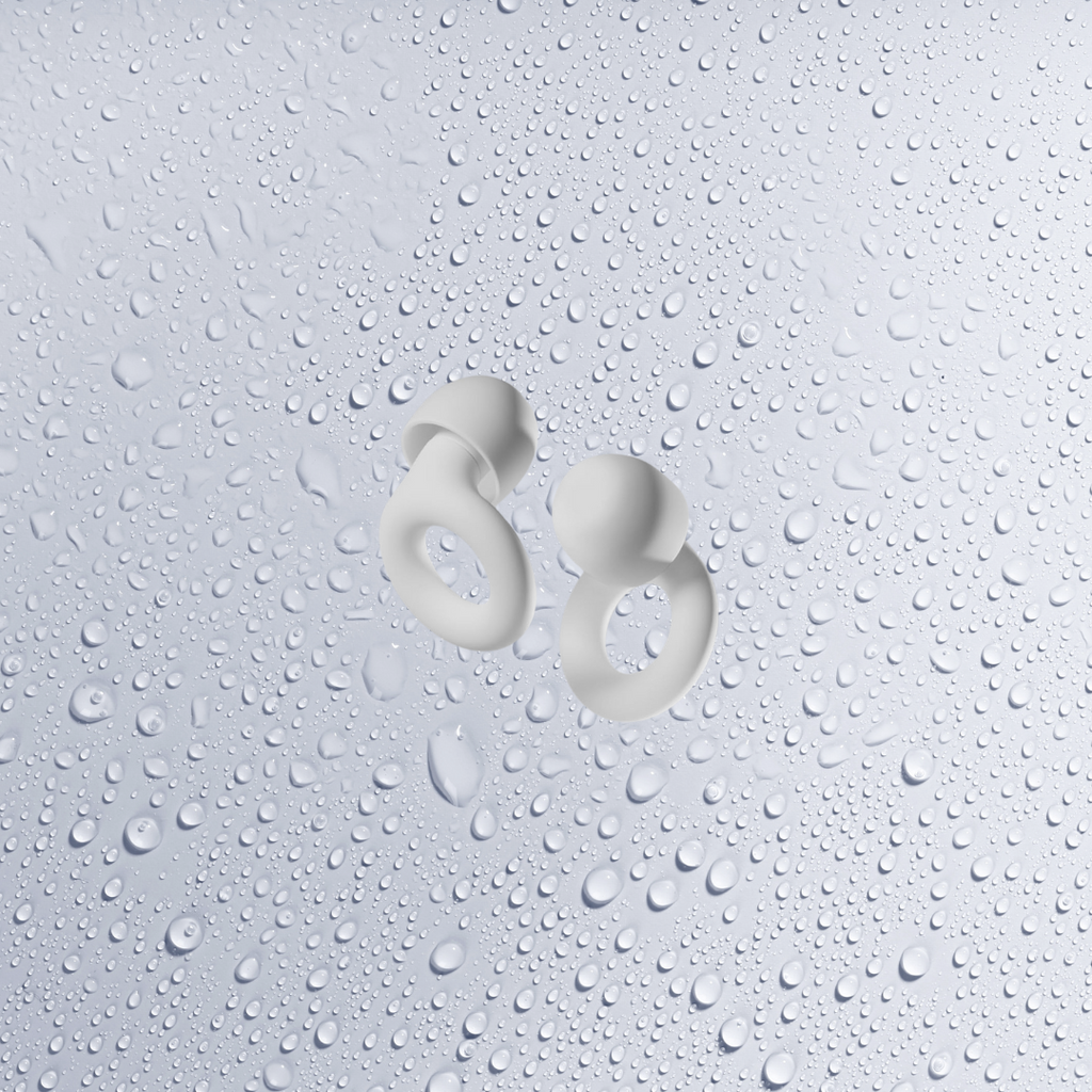 White ear plugs with white background with water droplets-Mularx